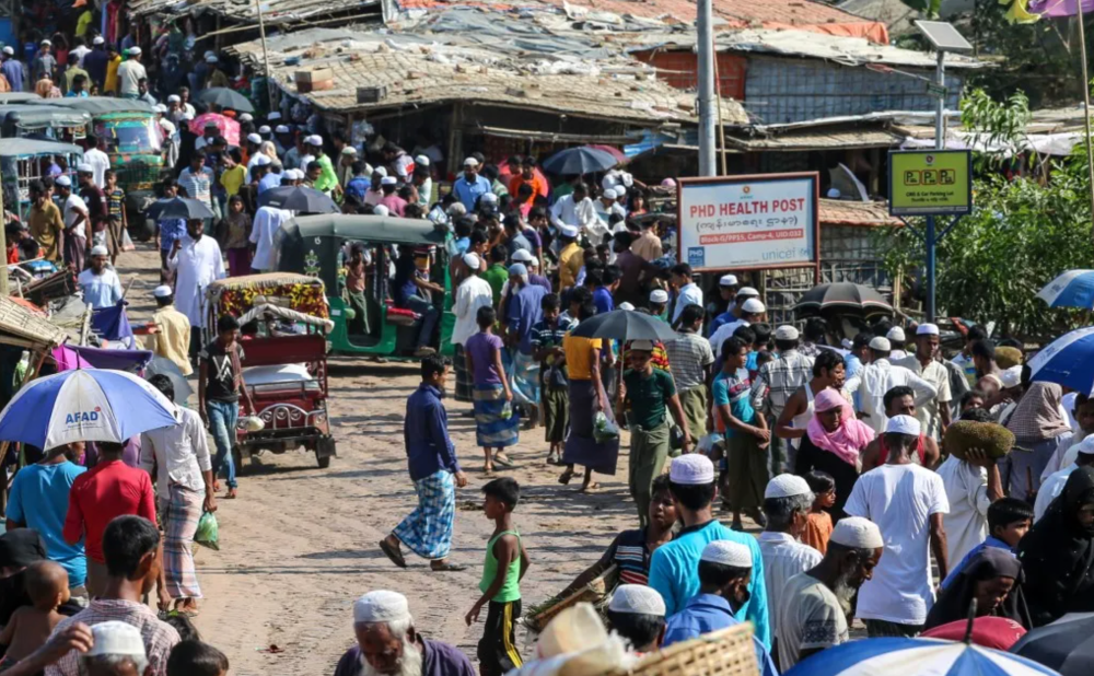 Rohingya gather at a market in Bangladesh’s Kutupalong refugee camp in Ukhia on May 15, 2020. (AFP)