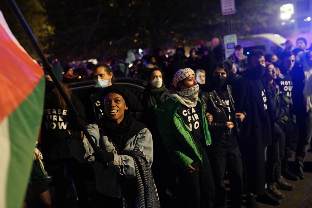Demonstrators stand near the headquarters of the Democratic National Committee Wednesday, Nov. 15, 2023, in Washington. (AP)