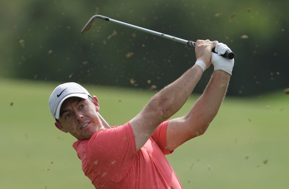 Rory McIlroy of Northern Ireland plays his second shot on the 3rd hole during the round one of the DP World Tour Championship golf tournament, in Dubai, United Arab Emirates, Thursday, Nov. 16, 2023. (AP)