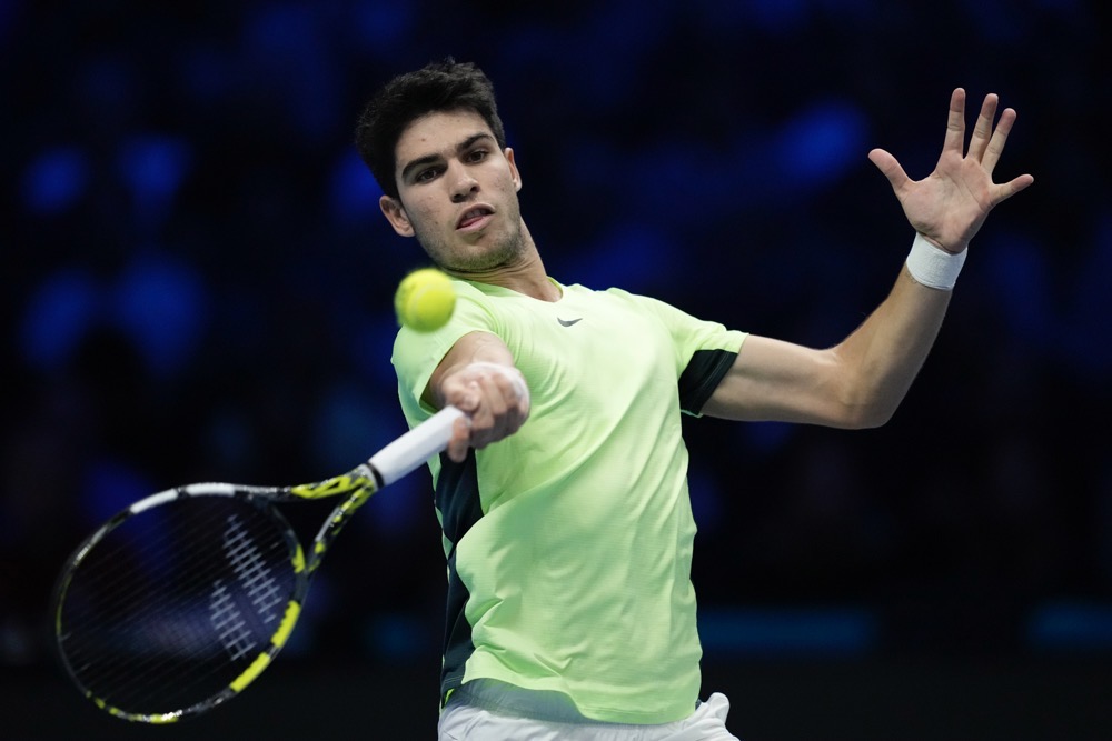 Spain's Carlos Alcaraz returns the ball to Russia's Daniil Medvedev during their singles tennis match of the ATP World Tour Finals at the Pala Alpitour in Turin Friday. (AP)