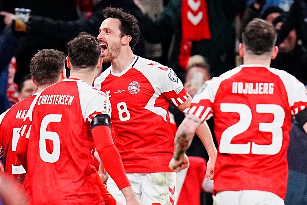 Denmark's Thomas Delaney celebrates scoring their second goal with teammates during the Euro 2024 Qualifier Group H match against Slovenia at Parken Stadium, Copenhagen, on Nov. 17, 2023. (Reuters)