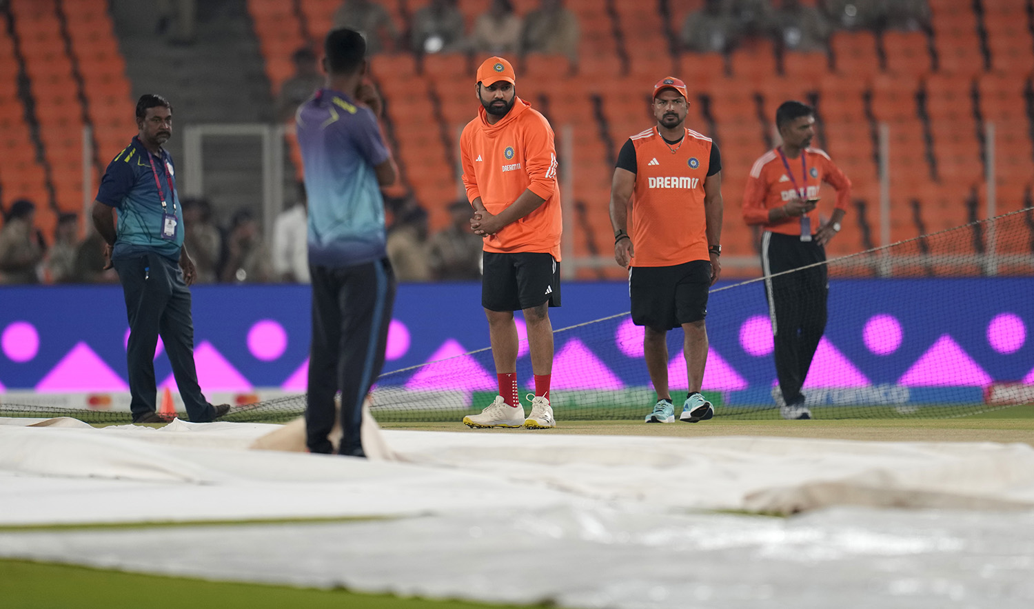 India's captain Rohit Sharma, center, inspects the pitch during a training session ahead of the ICC Men's Cricket World Cup final match between India and Australia in Ahmedabad, India, on November 18, 2023. (AP)