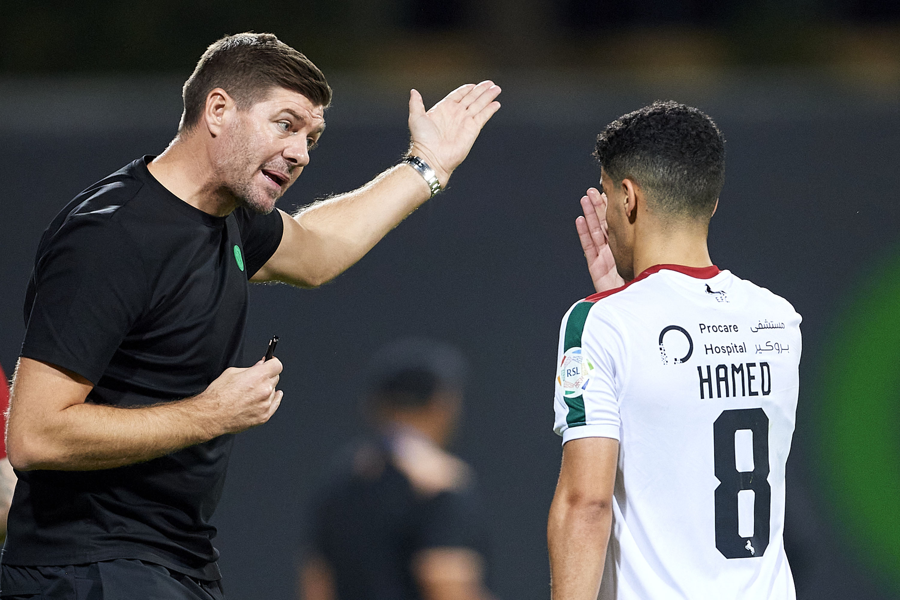 Ettifaq coach Steven Gerrard speaks to Hamed Al-Ghamdi during the Roshn Saudi Pro League match against Al Fayha. (Getty images)