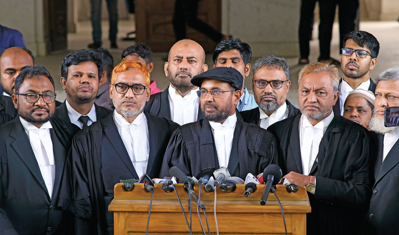 Jamaat-e-Islami’s lawyers address journalists after Bangladesh’s highest court dismissed their appeal seeking overturn of a previous High Court decision cancelling its registration with the Election Commission in Dhaka. (AP)