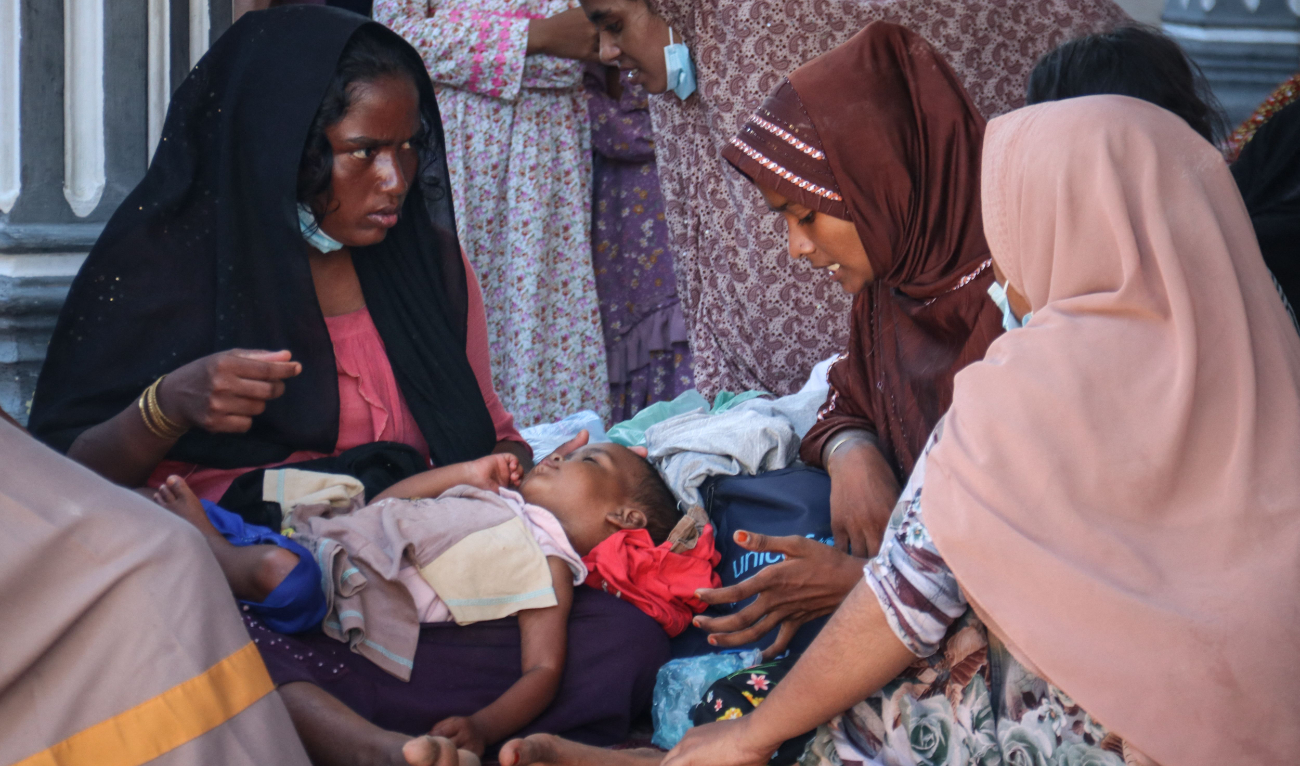 Newly arrived Rohingya refugees rest at a local prayer hall in Kulee, Aceh, on November 19, 2023. (AFP)
