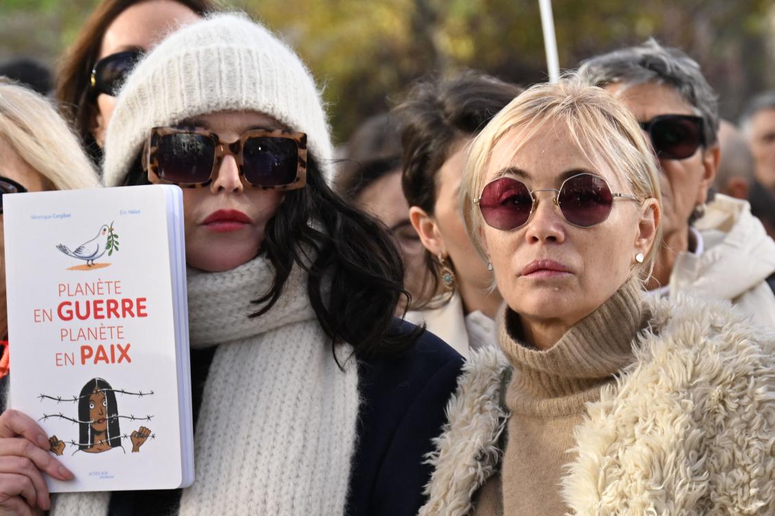 French actresses Isabelle Adjani (L) and Emmanuelle Beart (R) take part in a “silent march”, as celebrities and artists for peace in the Middle East, in Paris on November 19, 2023. (AFP)