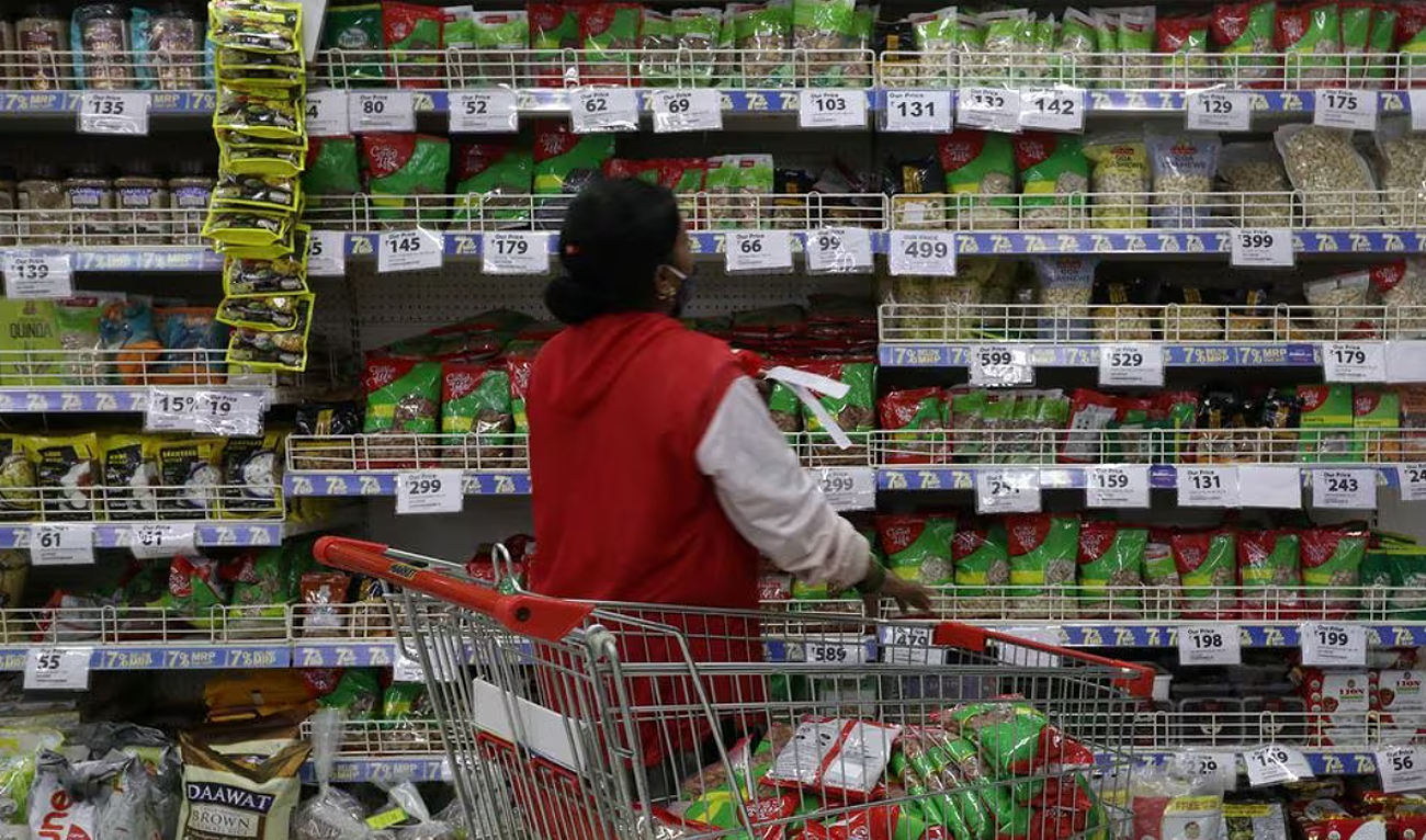 A worker arranges goods in a Reliance supermarket in Mumbai, India, March 16, 2021. (REUTERS/File)