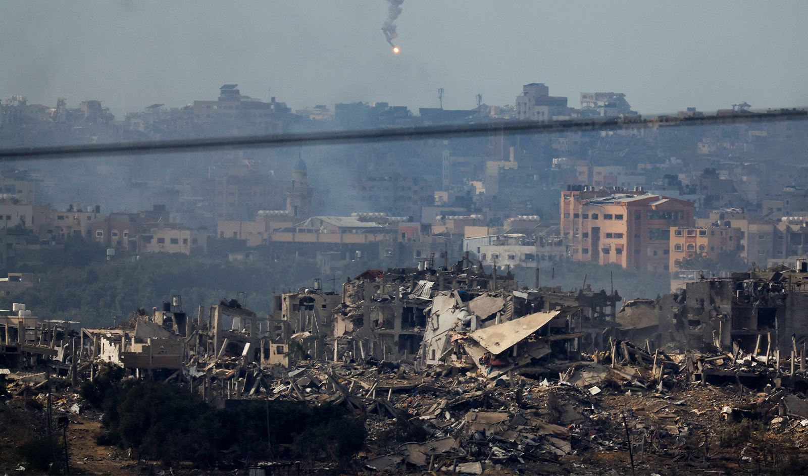 A flare fired by the Israeli military flies over Gaza, as seen from southern Israel, on November 20, 2023. (REUTERS)