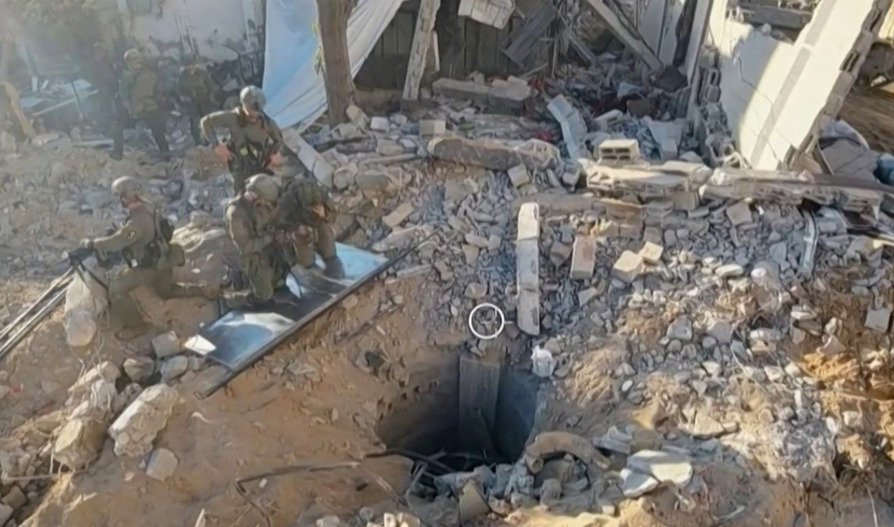 This grab from handout footage released by the Israeli army on November 17, 2023, shows what the army says is the entrance of a tunnel under Gaza’s Al-Shifa hospital that stretches beneath the complex where troops have been conducting a major operation. (AFP)