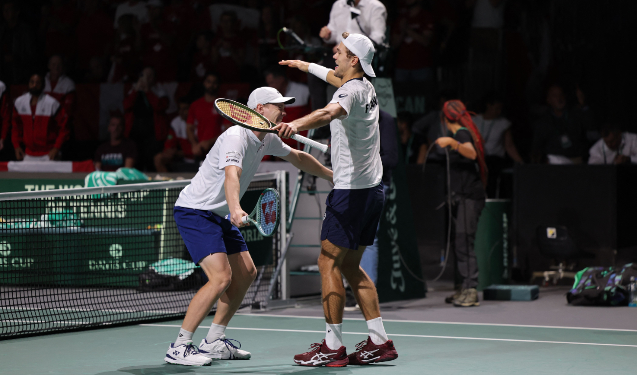 Finland's Harri Heliovaara (L) and Otto Virtanen celebrate after winning against Canada's Alexis Galarneau and Vasek Pospisil during the men's doubles quarter-final between Canada and Finland at the Davis Cup tennis tournament at the Martin Carpena sportshall, in Malaga on Nov. 21, 2023. (AFP)