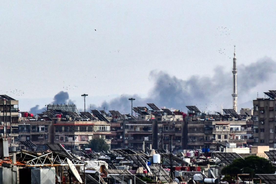 Smoke billows above buildings after an Israeli strike on the outskirts of Damascus on Nov. 22, 2023. (AFP)