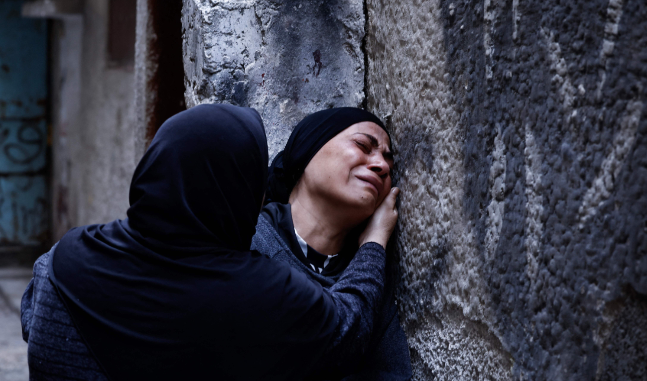 Relatives cry during the funeral of Palestinian Hussein Abu Jaasa, 52, who was killed during an Israeli raid in the Balata refugee camp, in Nablus, occupied West Bank, on Wednesday. (AFP)