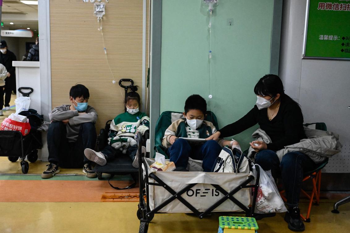 Children receive a drip at a children hospital in Beijing on November 23 (AFP)