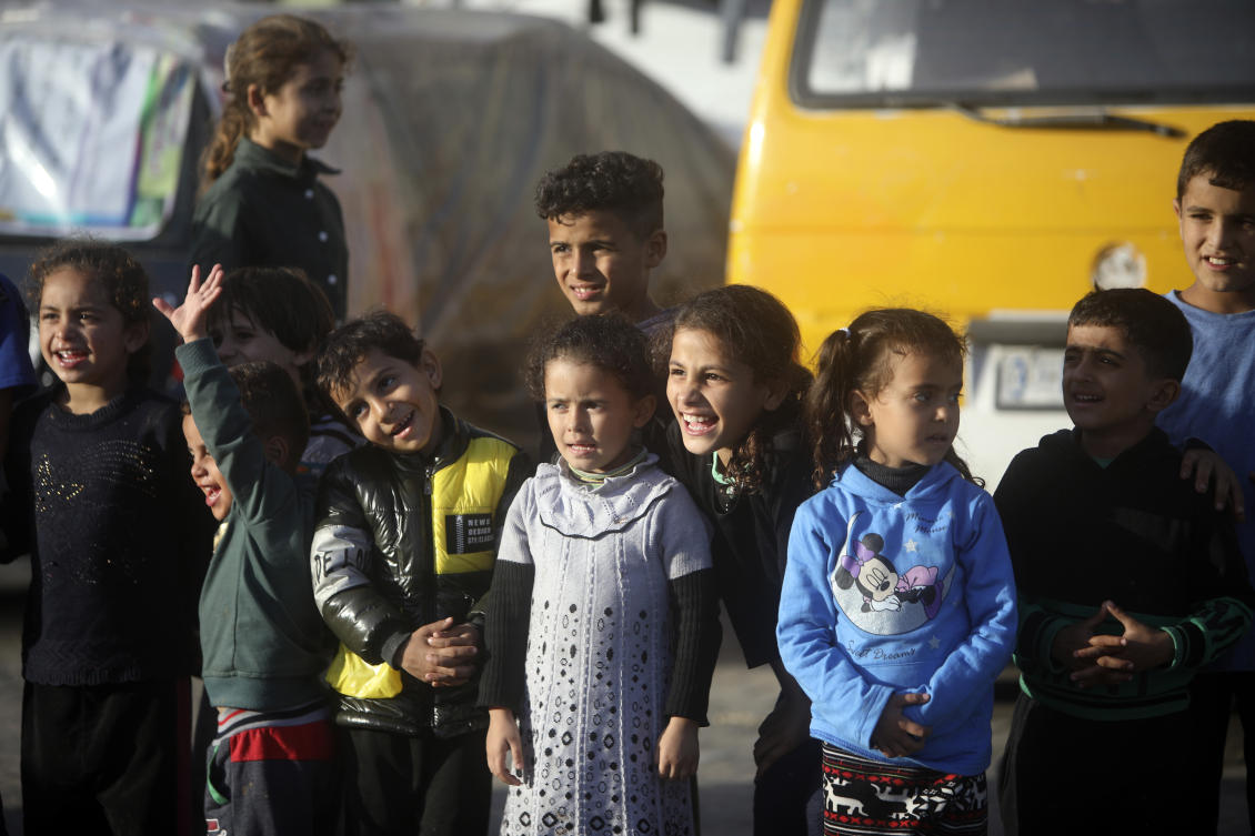 Displaced Palestinian children sheltering at a UN school, attend an entertainment performance in Rafah refugee camp, southern Gaza Strip, on Nov. 23, 2023. (AP)