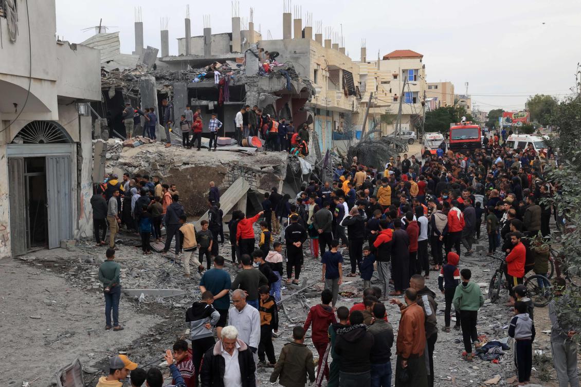 Palestinians gather at the site of Israeli bombardment on Rafah in the southern Gaza Strip on Nov. 22, 2023. (AFP)