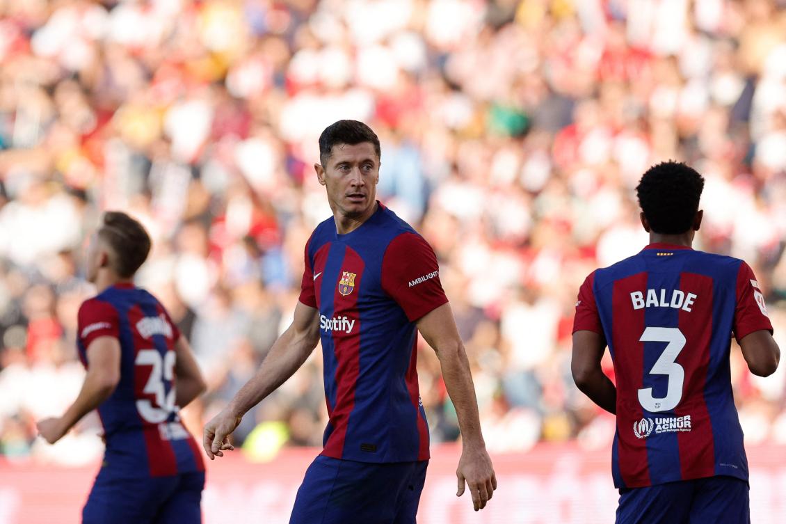 Barcelona’s Polish forward Robert Lewandowski reacts after Rayo Vallecano’s French defender Florian Lejeune scored an own goal during their Spanish league match on Nov. 25, 2023. (AFP)
