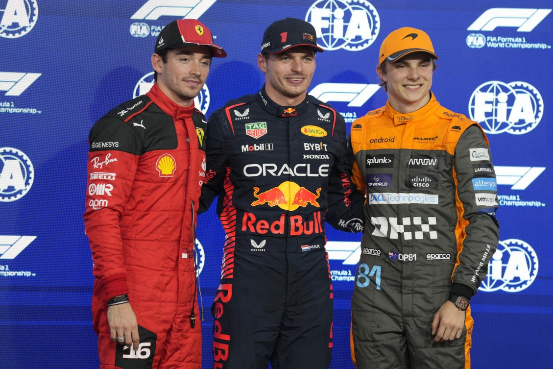Ferrari driver Charles Leclerc of Monaco, Red Bull driver Max Verstappen of the Netherlands, and McLaren driver Oscar Piastri of Australia pose after qualifying session ahead of the Abu Dhabi Formula One Grand Prix at the Yas Marina Circuit, Abu Dhabi on Nov. 25, 2023. (AP)