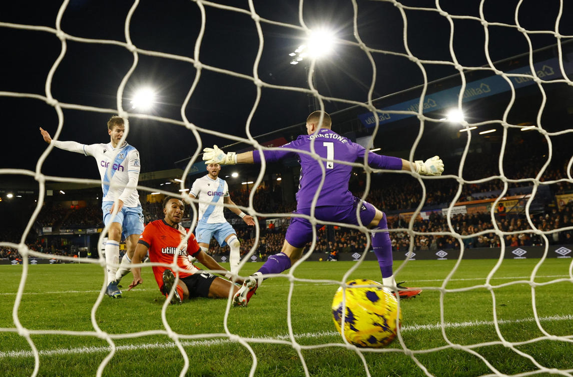 Luton Town’s Jacob Brown scores their second goal past Crystal Palace’s Sam Johnstone during their Premier League match at Kenilworth Road, Luton, on Nov. 25, 2023. (Reuters)