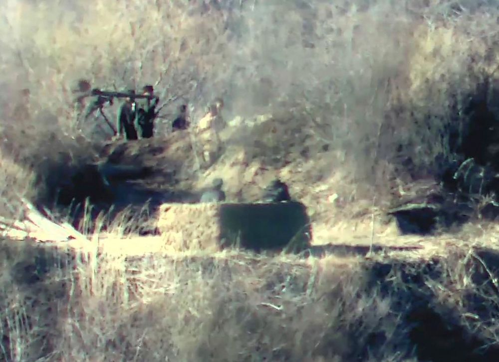 Above, North Korean soldiers near a guard post on the North side of the Demilitarized zone in this undated handout photo released on Nov. 27, 2023 by the South Korean Defense Ministry. (South Korean Defense Ministry/AFP)