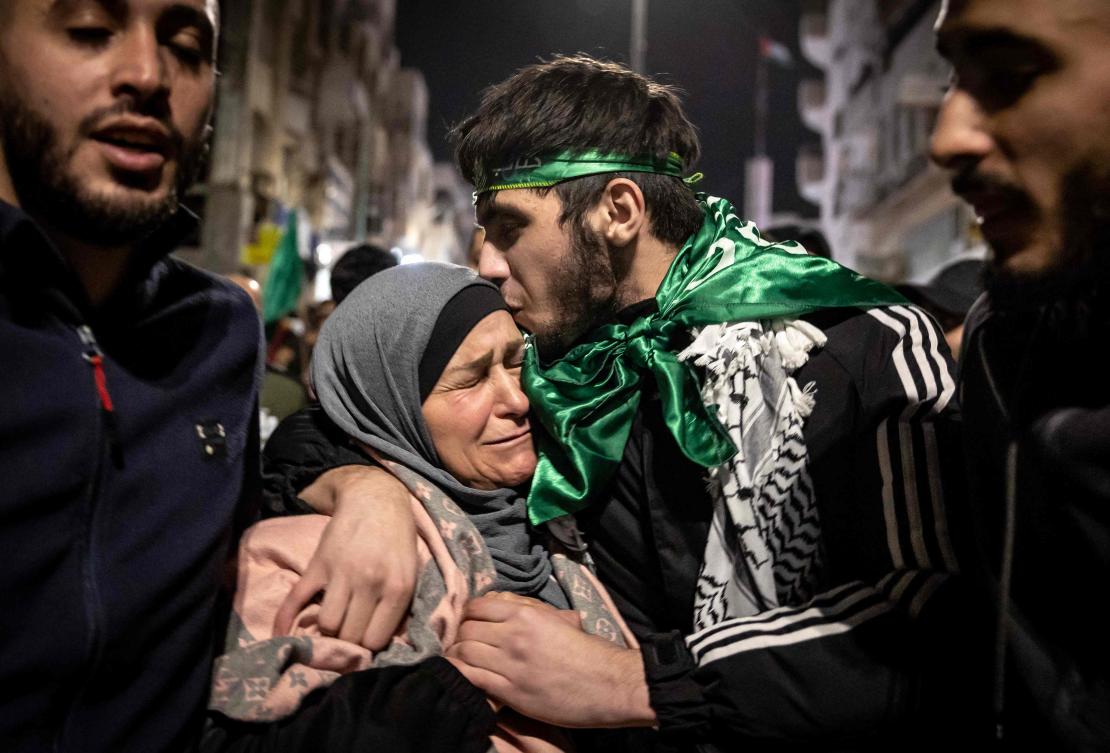 A Palestinian prisoner hugs his mother after being released from an Israeli jail on Nov. 26, 2023. (AFP)