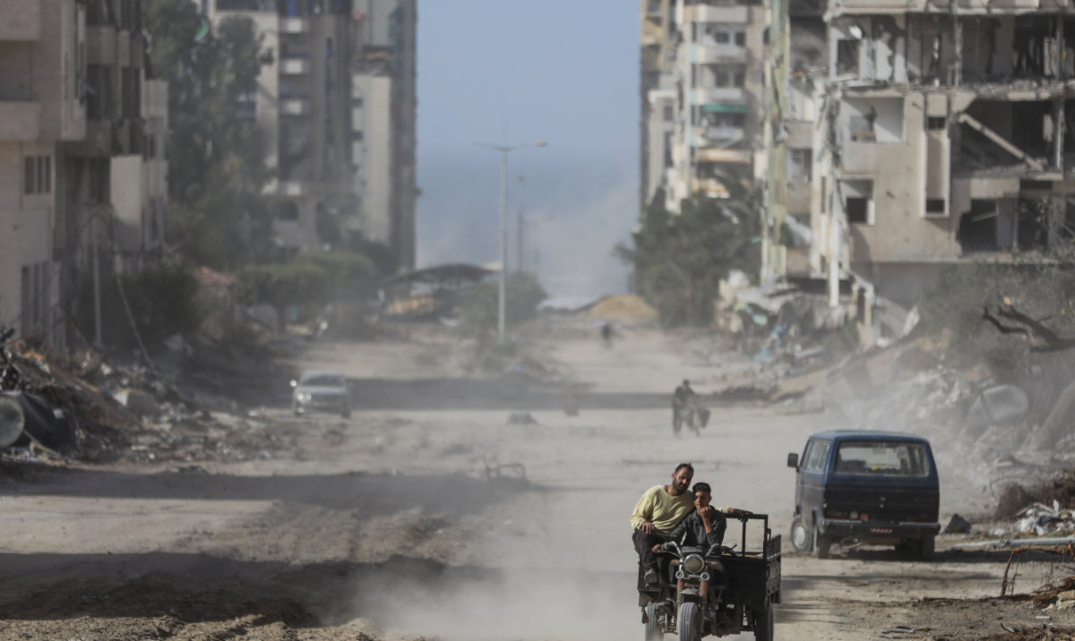 Palestinians drive through Gaza City on Sunday, Nov. 26, 2023. (AP)