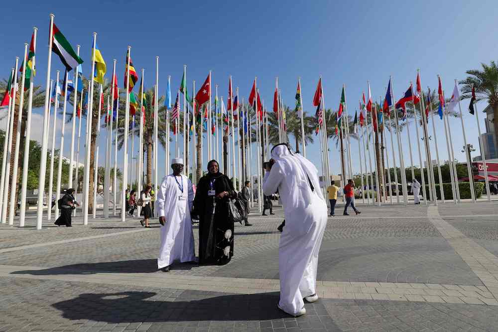 Delegates have their pictures taken at the venue of the COP28 United Nations climate summit in Dubai on Nov. 30, 2023. (Reuters)