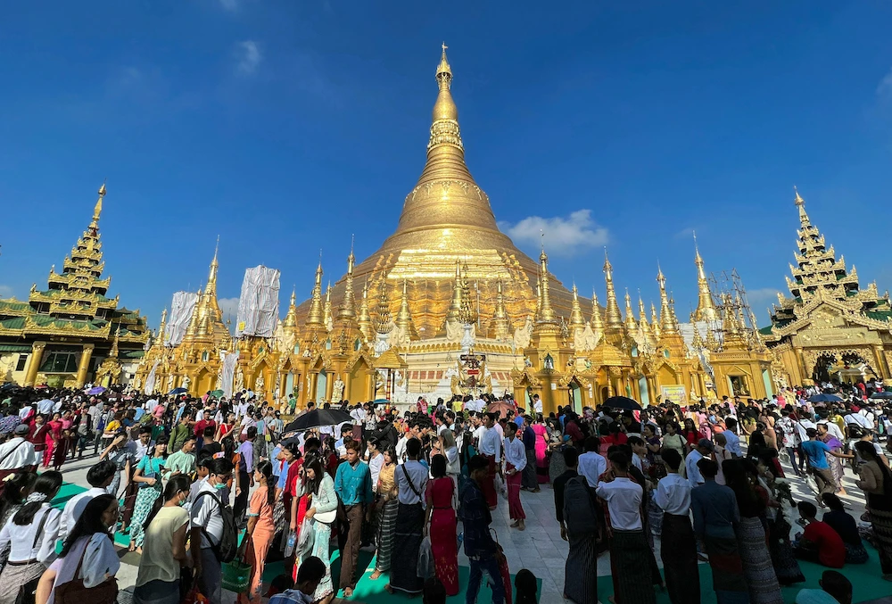 Buddhist devotees visit the Shwedagon pagoda to mark the full moon day of the Thadingyut festival in Yangon on October 29, 2023. (AFP)