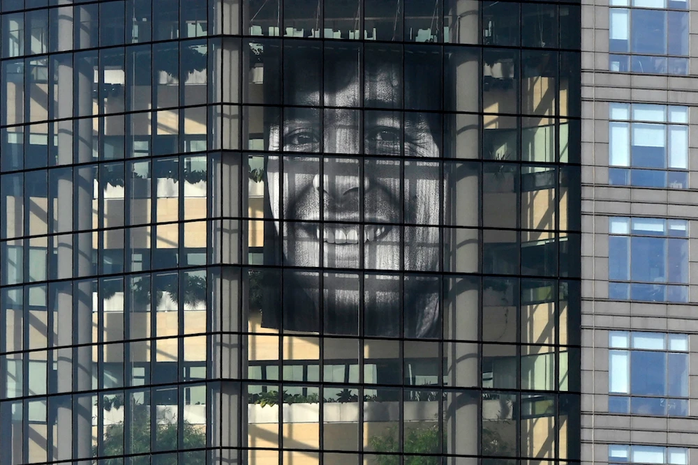 An image of Argentine late football legend Diego Maradona is displayed on the headquarters of the Argentine oil company YPF on the 63th anniversary of his birth, in Buenos Aires on October 30, 2023. (AFP)