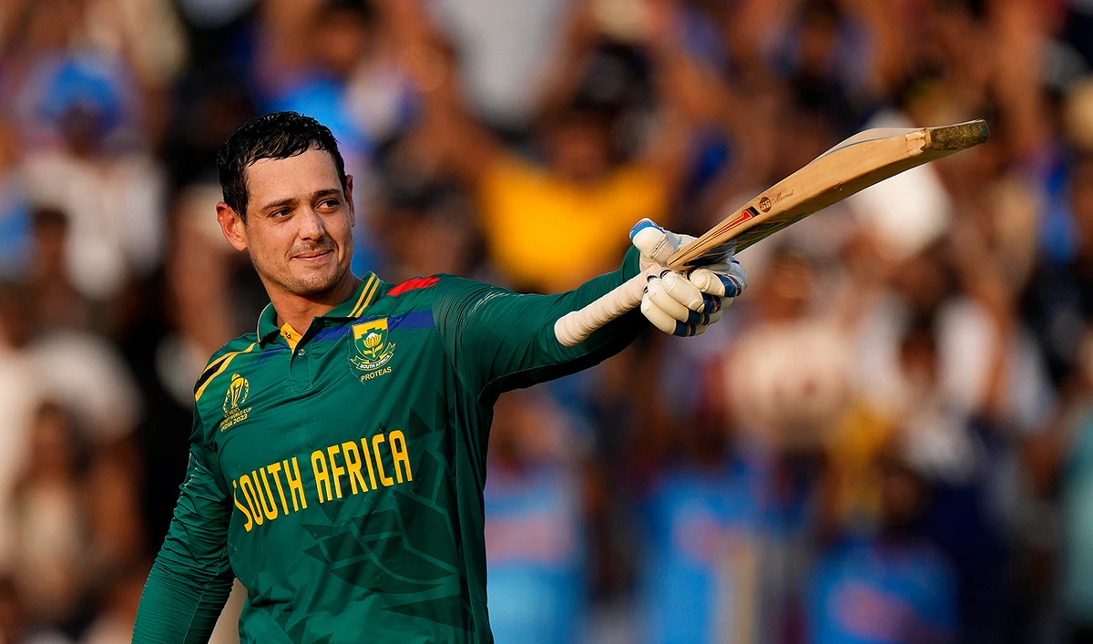 South Africa's wicketkeeper Quinton De Kock celebrates his century during the ICC Men's Cricket World Cup match between New Zealand and South Africa, in Pune, India, Wednesday, Nov. 1, 2023. (AP)