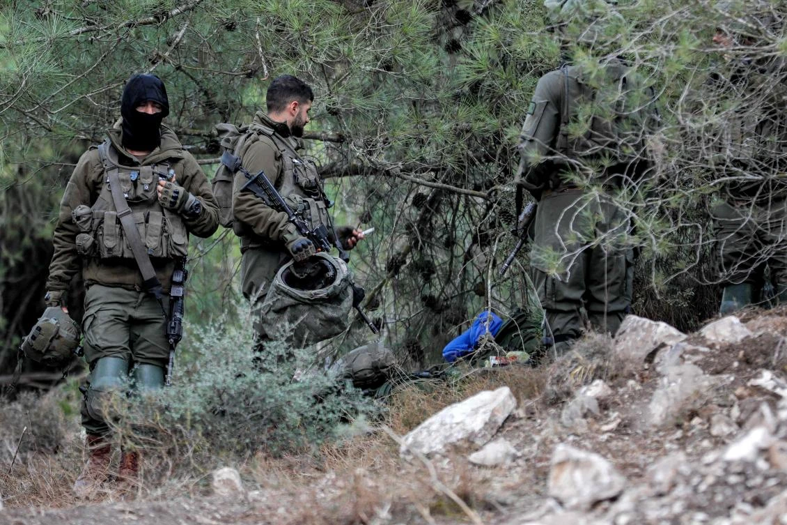 Israeli army soldiers wait at a position in the upper Galilee region of northern Israel near the border with Lebanon on Nov. 1, 2023 amid increasing cross-border tensions between Hezbollah and Israel. (AFP)