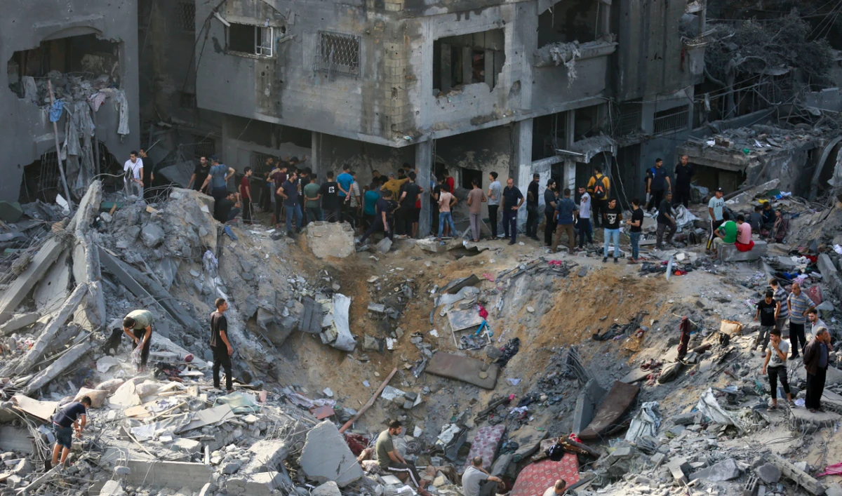Palestinians check the destruction in the aftermath of an Israeli strike the previous night in the Jabalia camp for Palestinian refugees in the Gaza Strip, on November 1, 2023, amid ongoing battles between Israel and the Palestinian Hamas movement. (AFP)