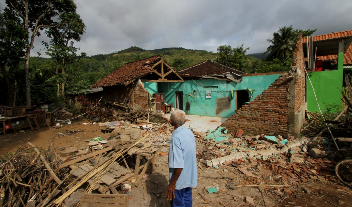 A villager looks at his damaged house at Ndelikan village in Wonogiri regency on July 1, 2023, a day after a magnitude 5.8 earthquake hit the area. (AFP/File)