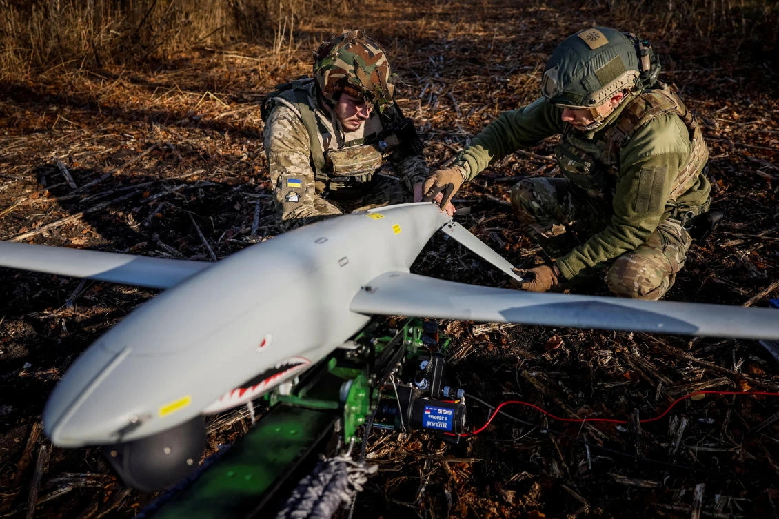 Servicemen of the 15th Separate Artillery Reconnaissance Brigade of the Armed Forces of Ukraine prepare a Shark drone for launching, amid Russia’s attack on Ukraine, in Kharkiv region, on Oct. 30, 2023. (Reuters/File)