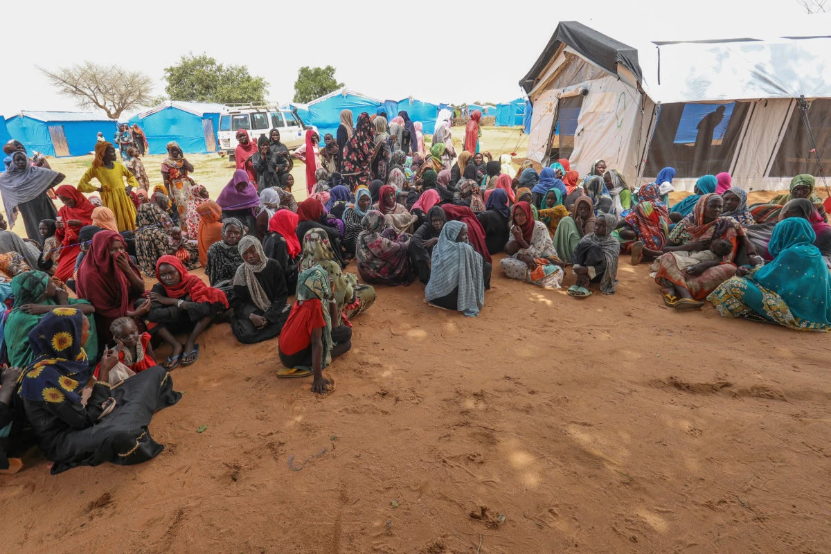 Women who fled the war in Sudan await the distribution of international aid rations at the Ourang refugee camp, near Adre town in eastern Chad on August 15, 2023. The Joint Human Rights Office in Sudan says it has received credible reports of more than 50 incidents of sexual violence linked to the conflict. (AFP)