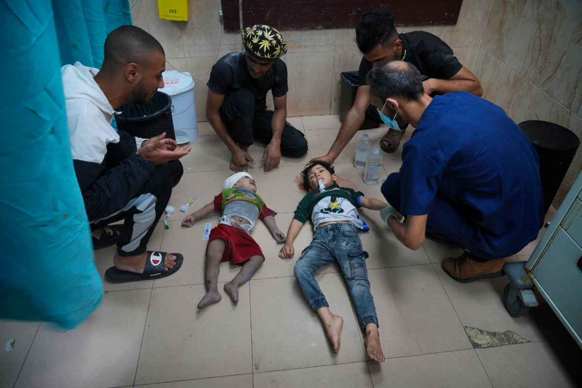 Palestinian children wounded in an Israeli bombardment are brought to a hospital in Deir al Balah, south of the Gaza Strip, on Nov. 2, 2023. (AP Photo/Hatem Moussa)