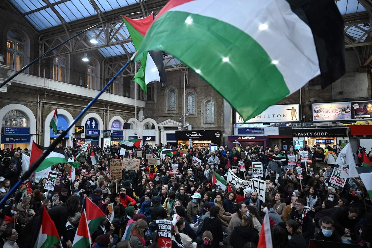 Demonstrators take part in a protest inside Charing Cross station following the 'London Rally For Palestine', in central London on November 4, 2023. (AFP)
