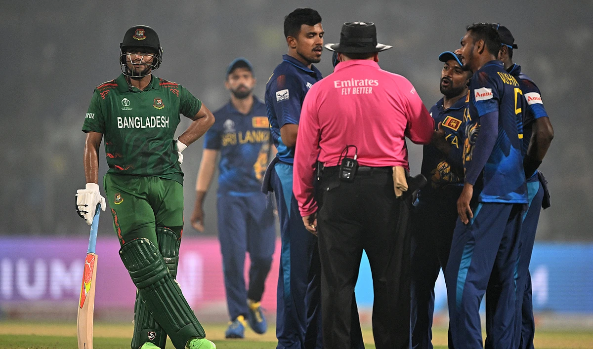 Sri Lanka's players speak with the umpire as Bangladesh's captain Shakib Al Hasan (L) watches during the 2023 ICC Men's Cricket World Cup one-day international (ODI) match between Bangladesh and Sri Lanka at the Arun Jaitley Stadium in New Delhi on November 6, 2023. (AFP)