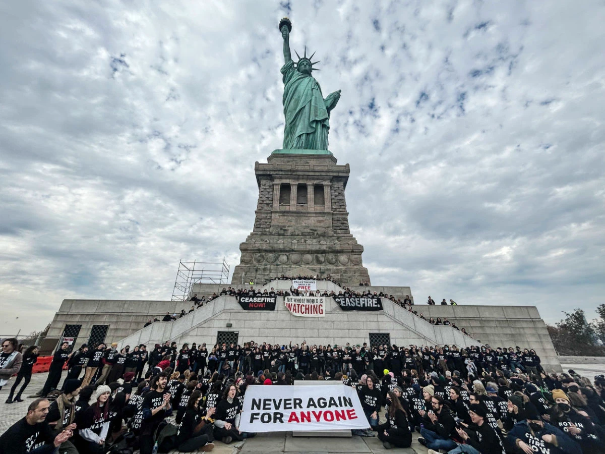 Activists from Jewish Voice for Peace occupy the pedestal of the Statue of Liberty on November 6, 2023 in New York City. (AFP)
