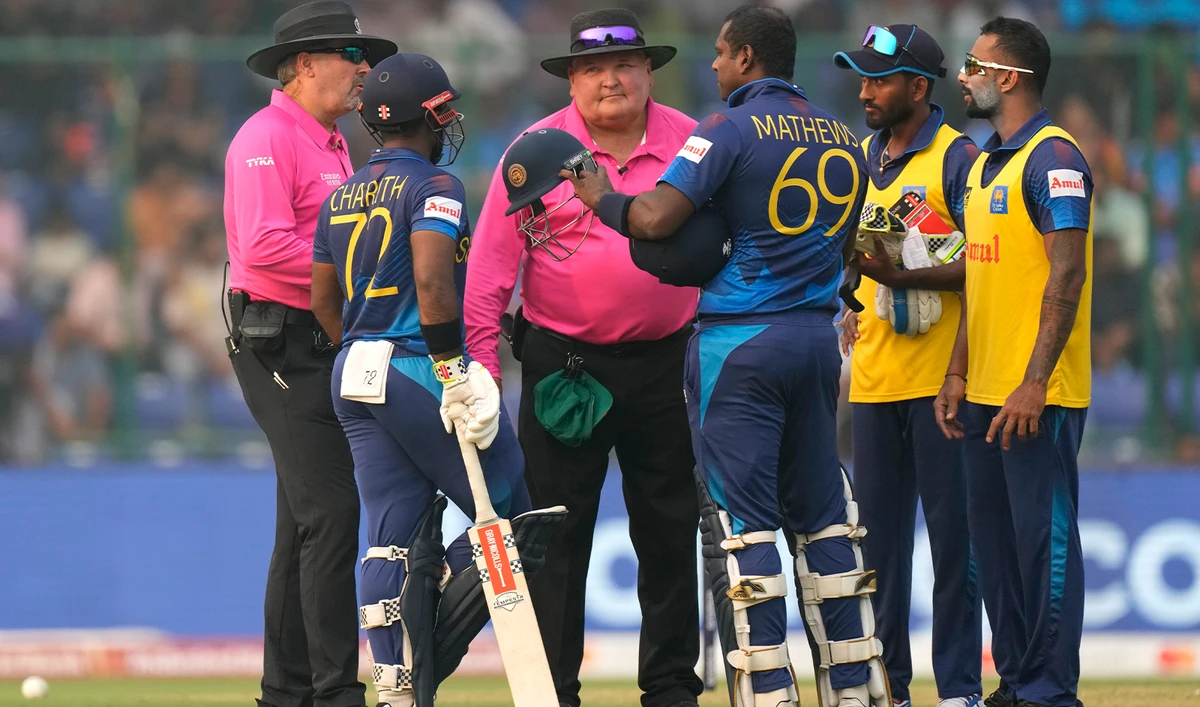 Sri Lanka's Angelo Mathews, center argues with umpires after he was declared timed out during the ICC Men's Cricket World Cup match between Bangladesh and Sri Lanka in New Delhi, India, on November 6, 2023. (AP)