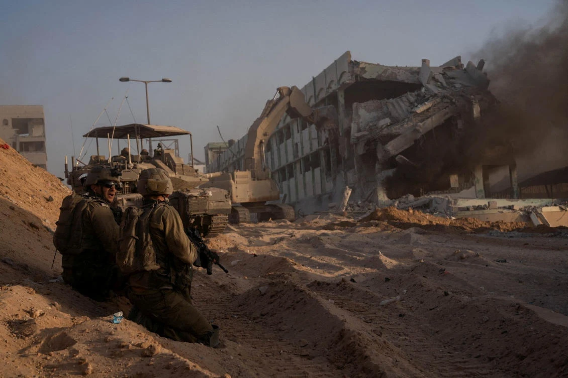 Israeli soldiers hold a position amid the ongoing ground operation of the Israeli army against the Palestinian Islamist group Hamas, in Gaza, on Nov. 8, 2023. (Reuters)