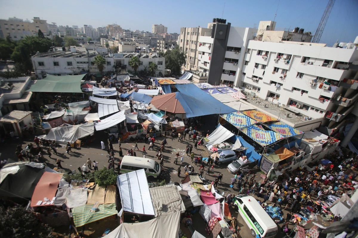 Displaced Palestinian families have set up makeshift tents outside Al-Shafaa. (AFP/File)