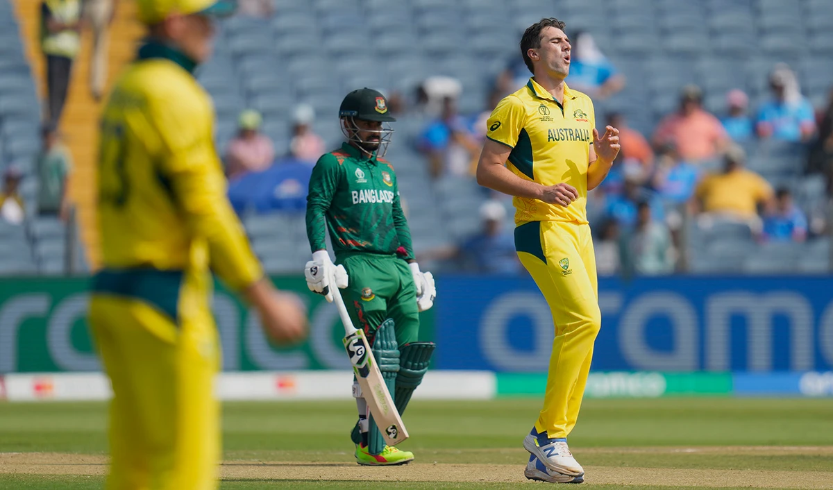 Australia's captain Pat Cummins reacts after a delivery during the ICC Men's Cricket World Cup match between Australia and Bangladesh in Pune, India, on November 11, 2023. (AP)