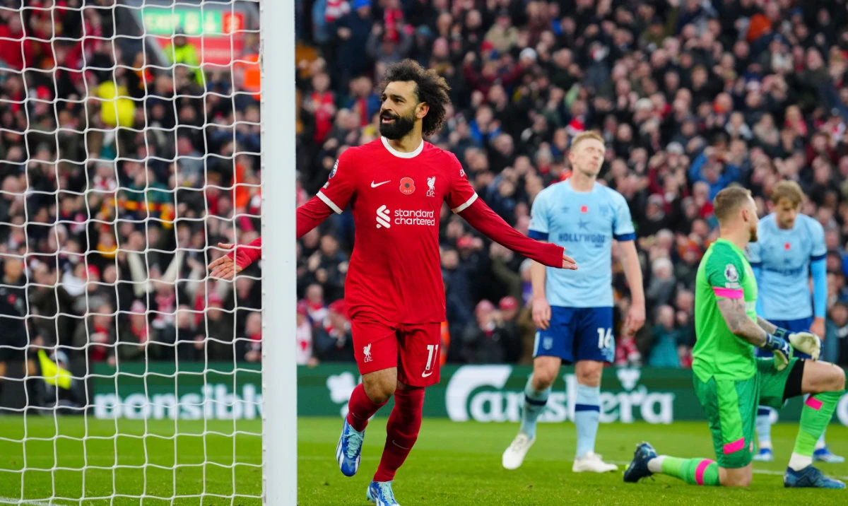 Liverpool's Mohamed Salah celebrates scoring his side's opening goal during the English Premier League soccer match between Liverpool and Brentford at Anfield stadium in Liverpool, England, Sunday, Nov. 12, 2023. (AP)