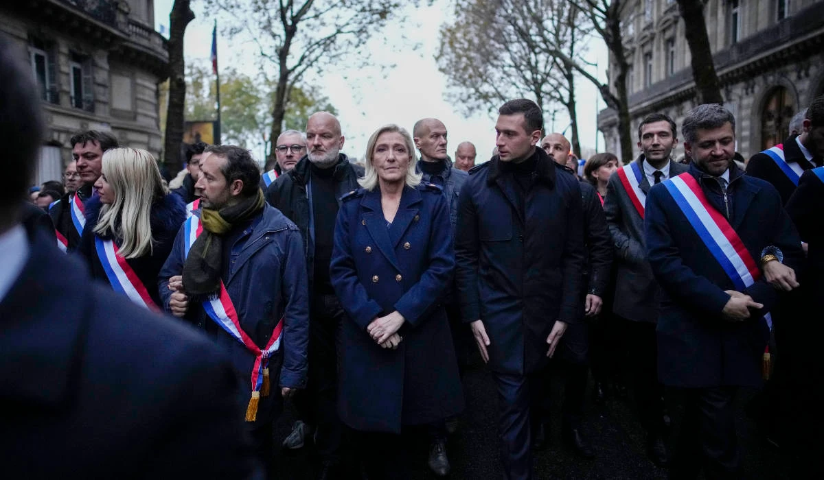 National Rally leader Marine Le Pen, center, joins thousands for a march against antisemitism in Paris, France, Sunday, Nov. 12, 2023. (AP)