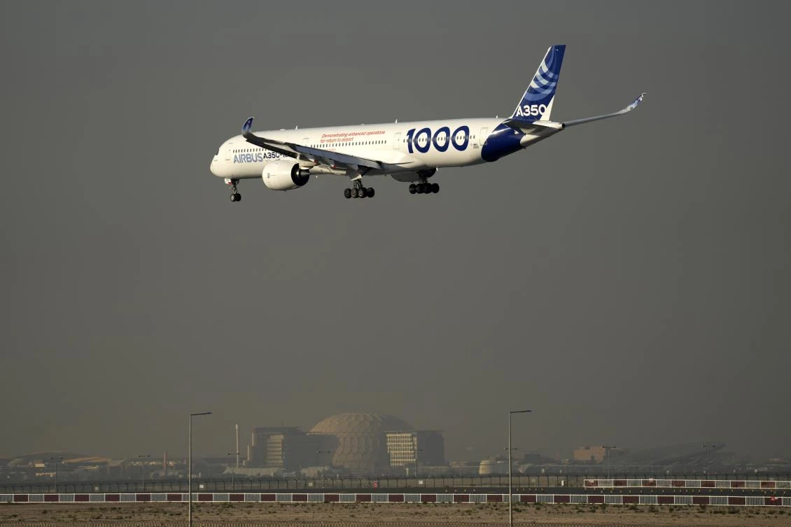 Above, an Airbus A350 prepares to land during the opening day of the Dubai Airshow on Nov. 13, 2023. Emirates has ruled out an immediate deal to buy Airbus A350 jets barring a breakthrough on engine talks with Rolls-Royce. (AP)