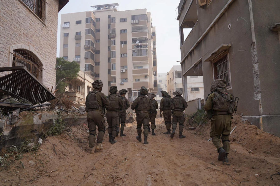 Above, Israeli soldiers during the ongoing ground operation in the Gaza Strip on Nov. 13, 2023. (Israel Defense Forces via Reuters)