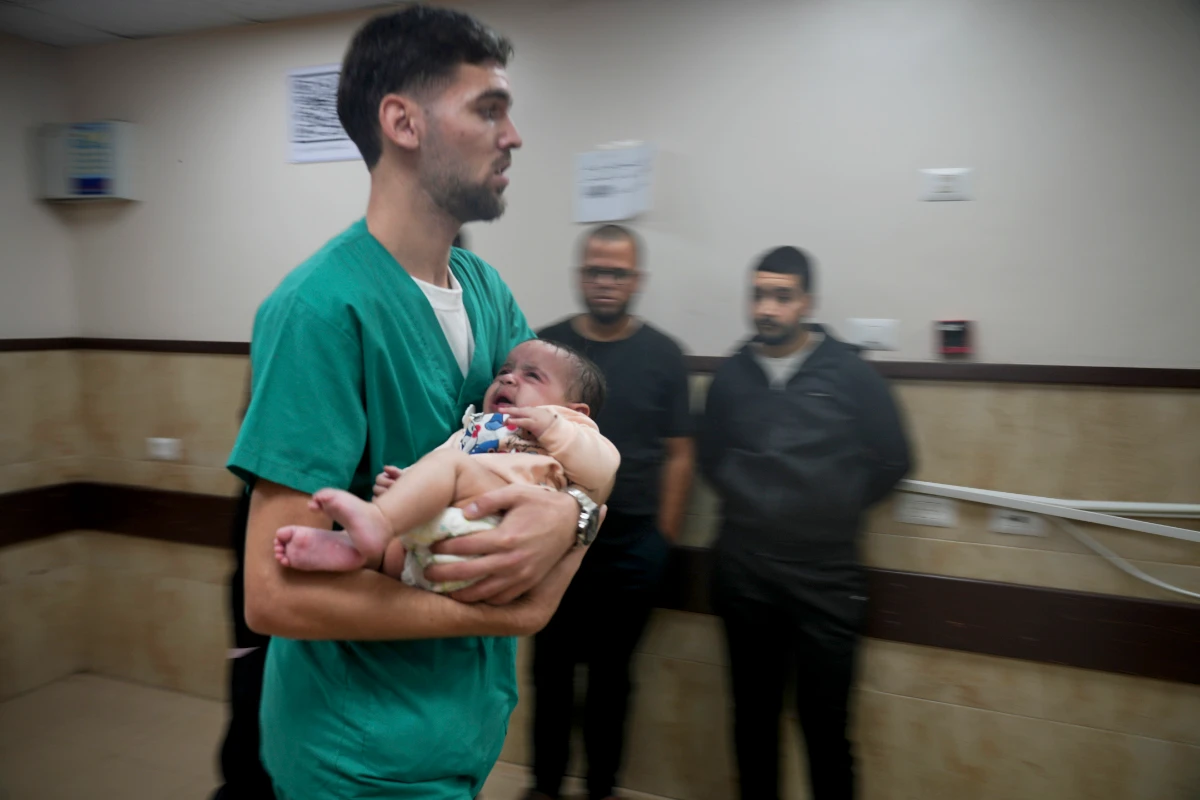 A Palestinian baby wounded in the Israeli bombardment of the Gaza Strip is brought to a hospital in Deir al-Balah on Tuesday, Nov. 14, 2023. (AP)