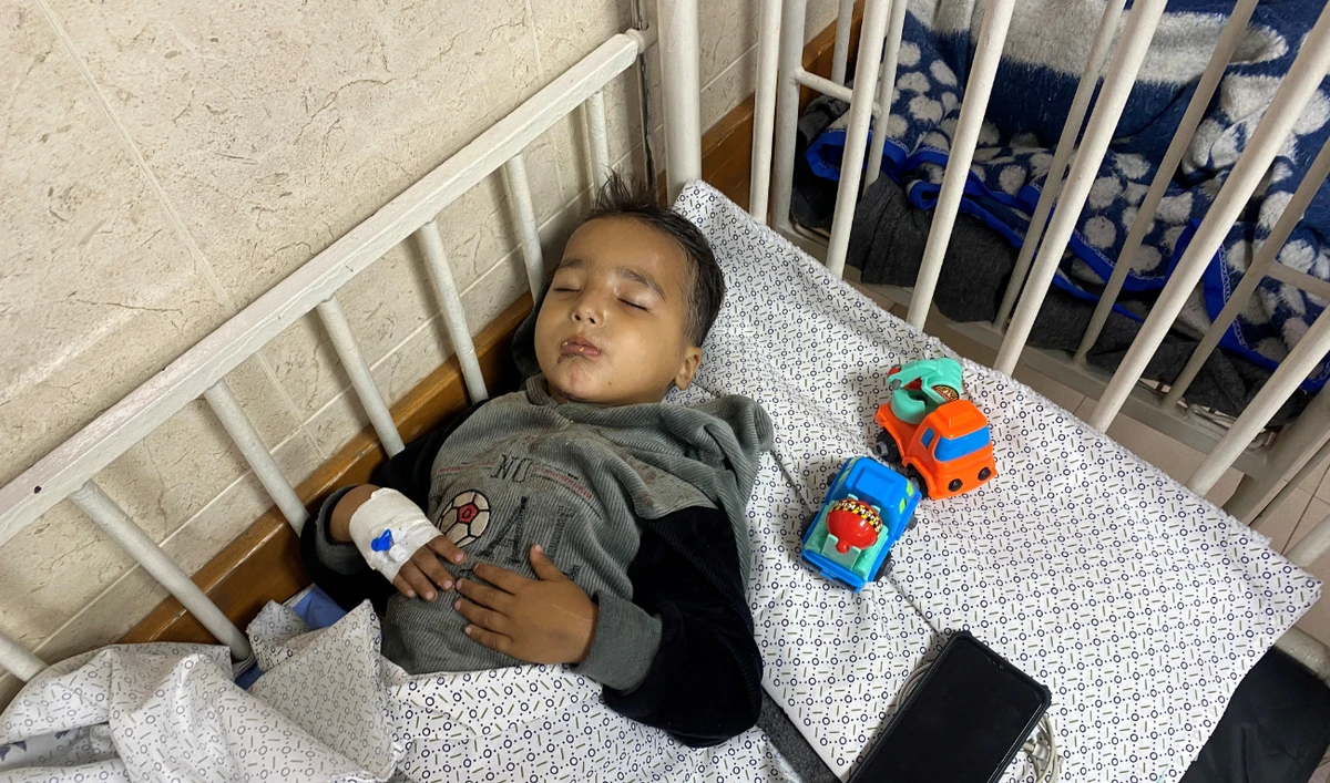 Ahmed Shabat, 4, who was subjected to two Israeli airstrikes, becoming an orphan in the first, and losing his lower limbs in the second, recovers at a hospital in Gaza. (Reuters)
