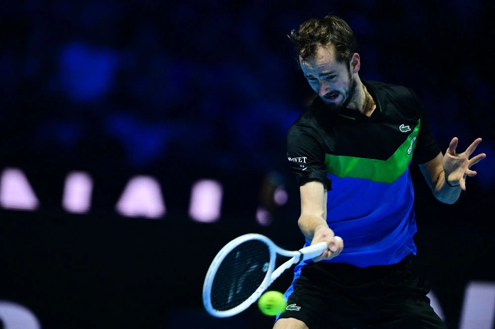 Daniil Medvedev plays a forehand return to Germany's Alexander Zverev during their round-robin match at the ATP Finals tennis tournament in Turin on Nov. 15, 2023. (AFP)