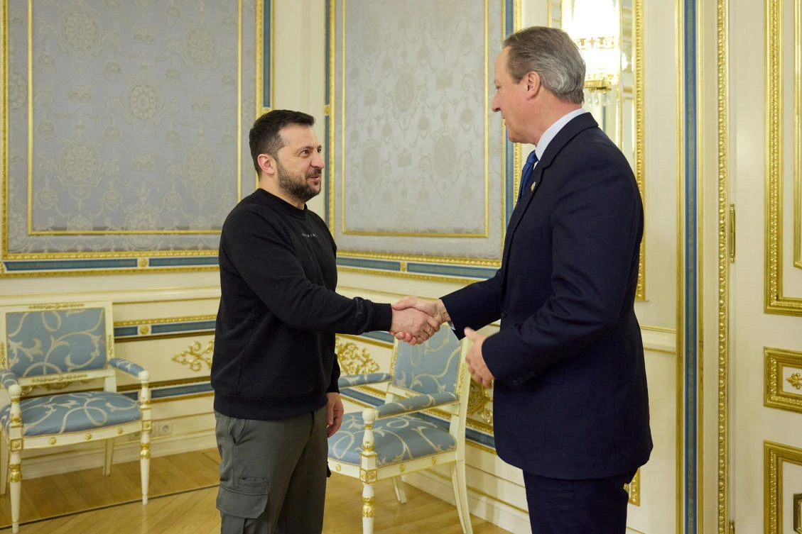 Ukraine’s President Volodymyr Zelensky welcomes Britain’s Foreign Secretary David Cameron before their meeting in Kyiv in this handout picture released November 16, 2023. (Ukrainian Presidential Press Service via Reuters)